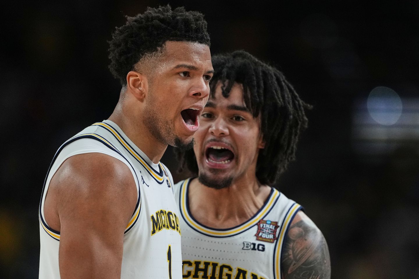 Michigan muscles its way to program's 2nd national title, beating stubborn UConn