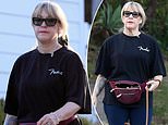 Actress and TV star who worked with Patrick Swayze in 80s cult classic is seen on rare outing... can you guess who?